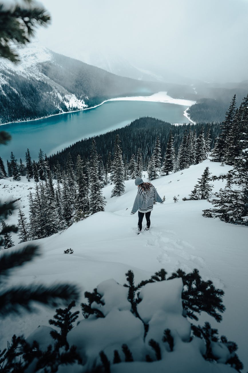 woman walking in snowy mountains