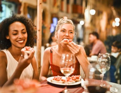 woman eating bruschetta